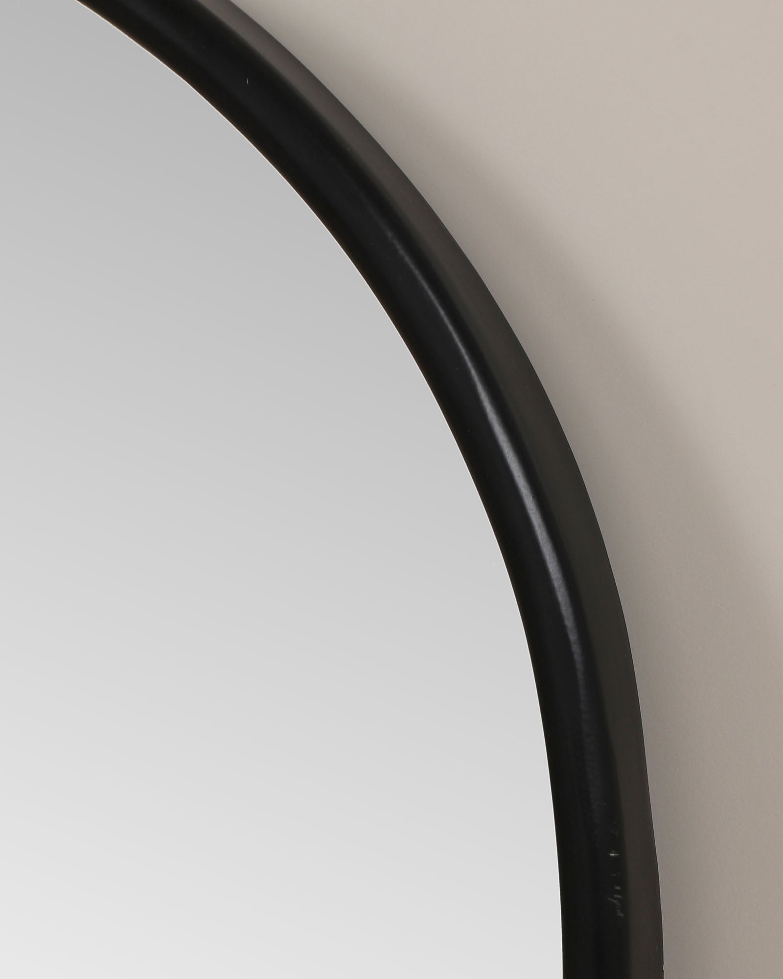 Modern wall mirror with built-in shelf for décor and essentials.