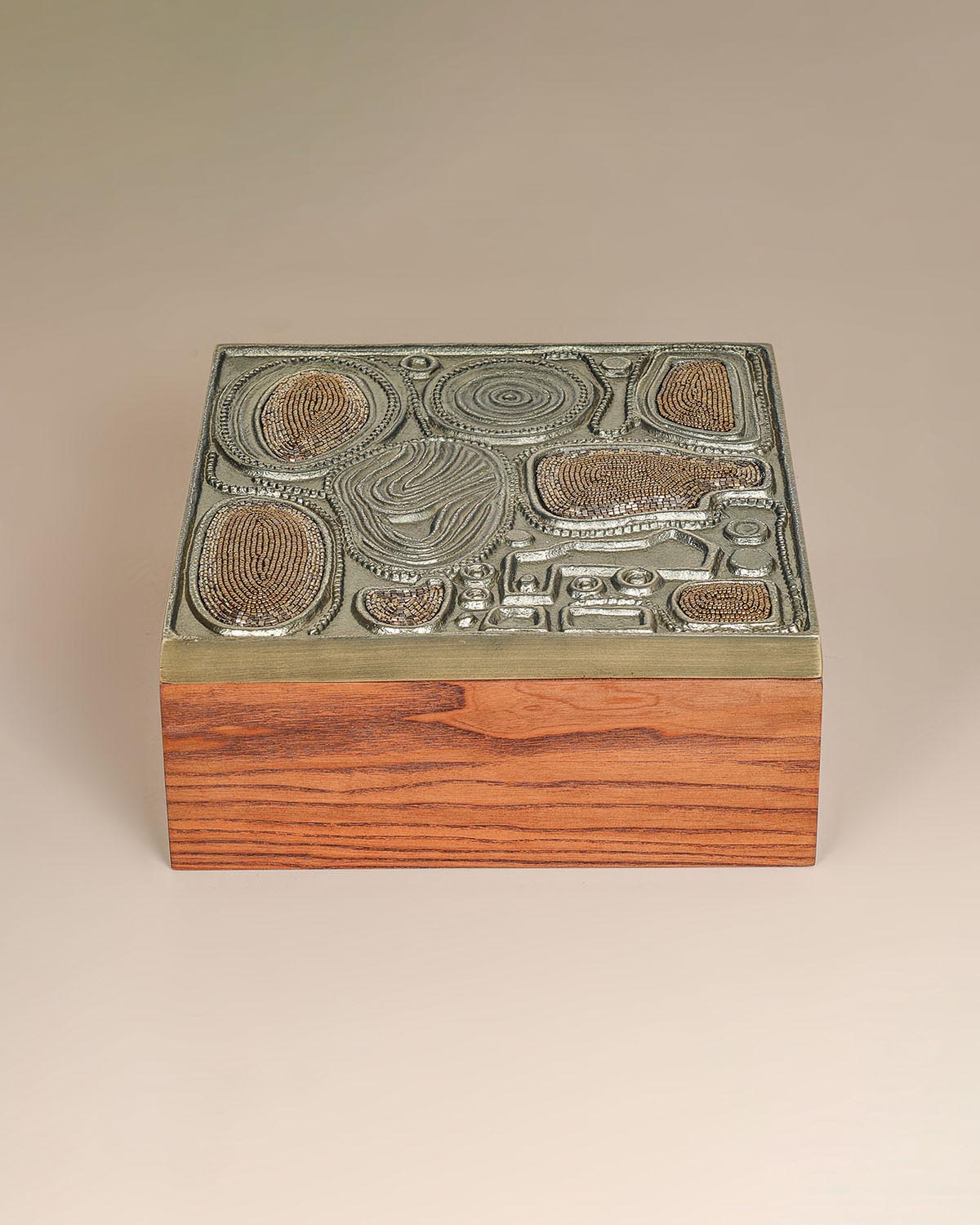 Luxury brass jewelry storage box with sculptural design and handcrafted texture.