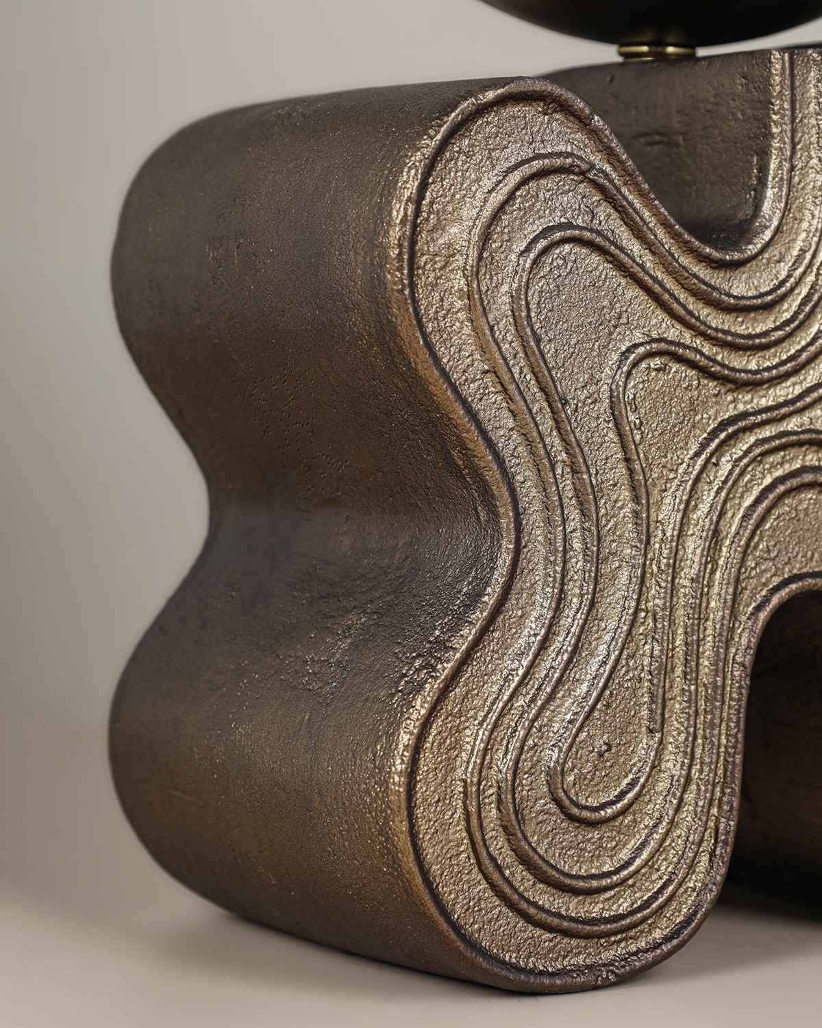 Eton Table Lamp with antique brass sculptural base and glass globe diffuser.