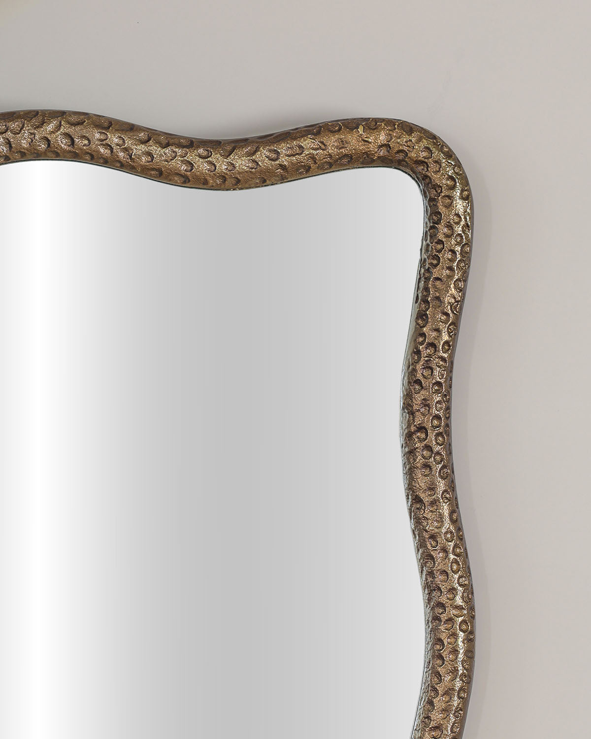 Luxury living room mirror crafted in textured antique brass with premium mirror glass.