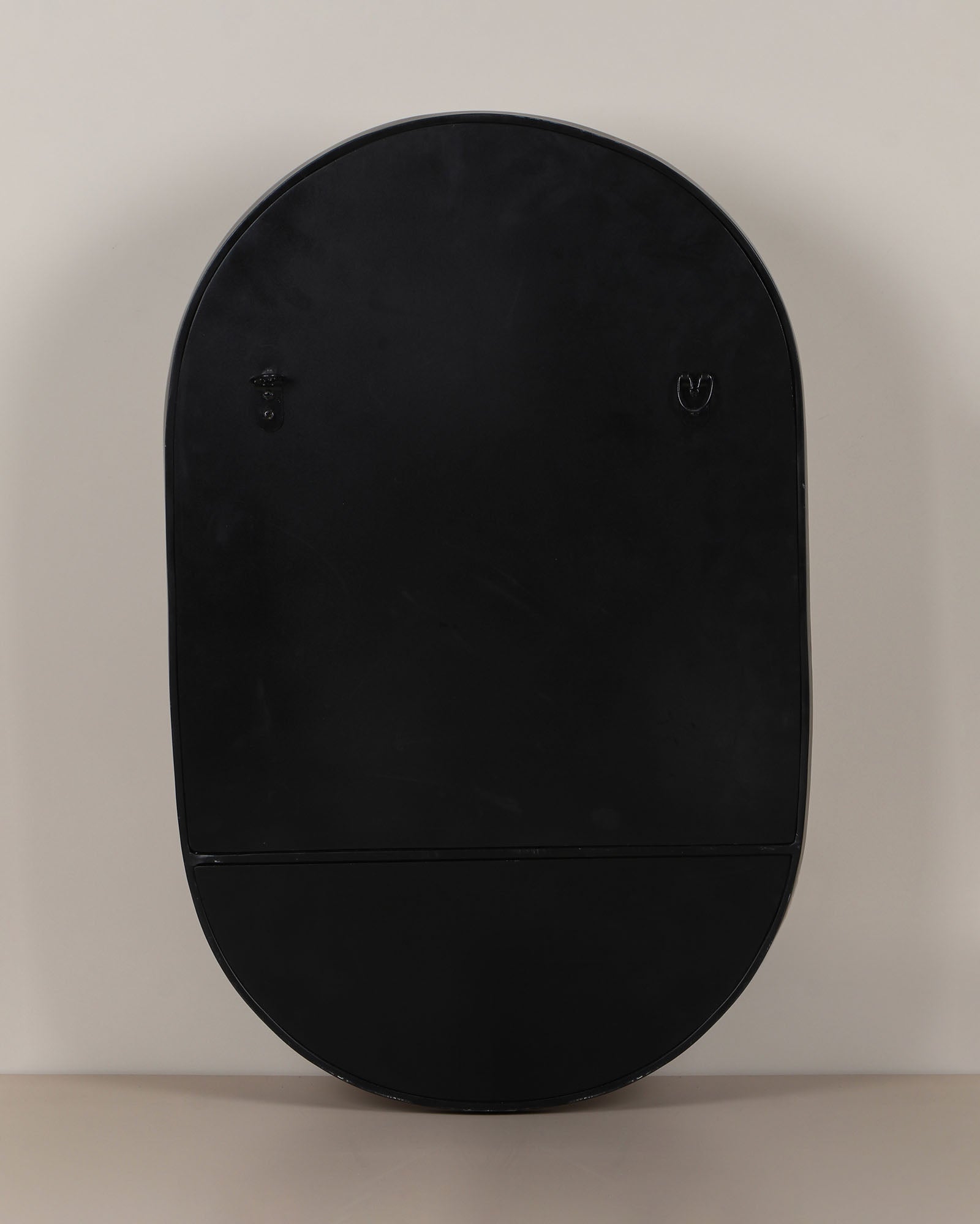 Modern wall mirror with built-in shelf for décor and essentials.