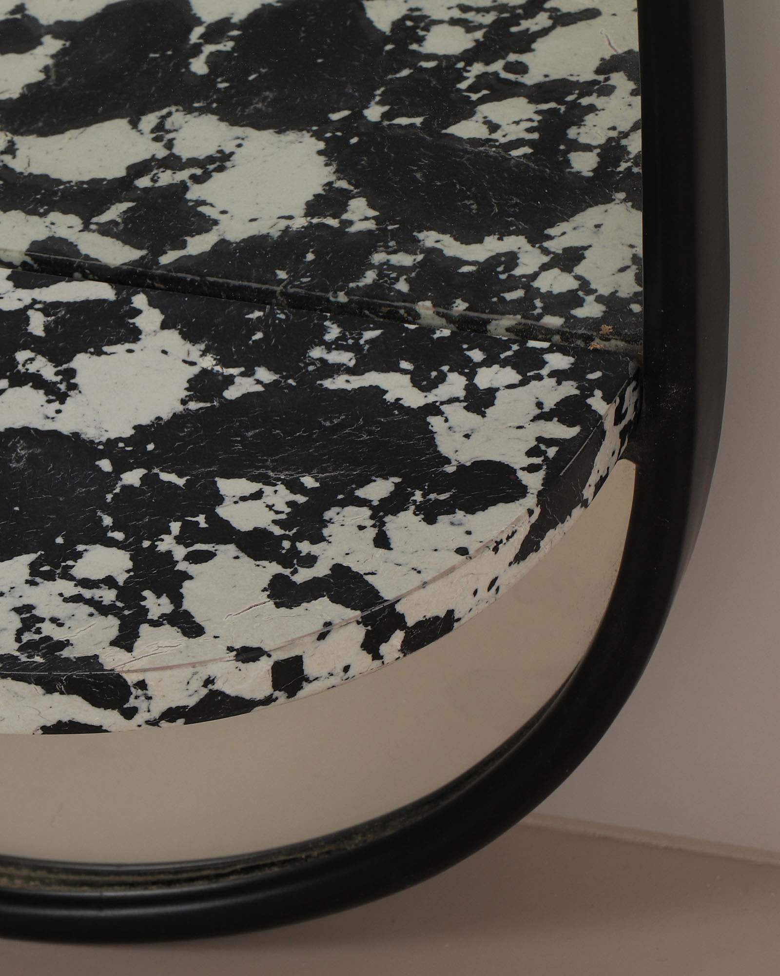 Modern wall mirror with built-in shelf for décor and essentials.