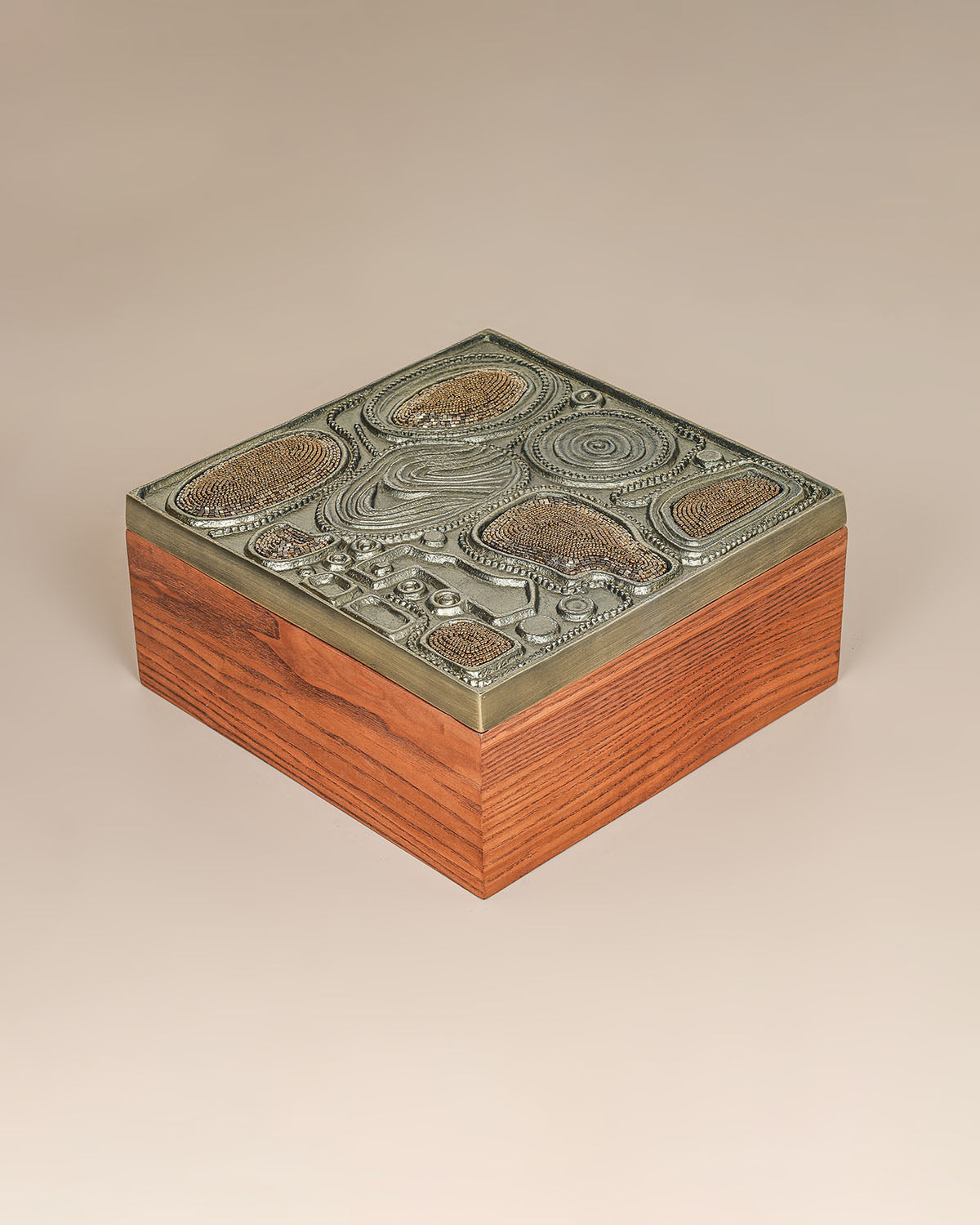 Luxury brass jewelry storage box with sculptural design and handcrafted texture.