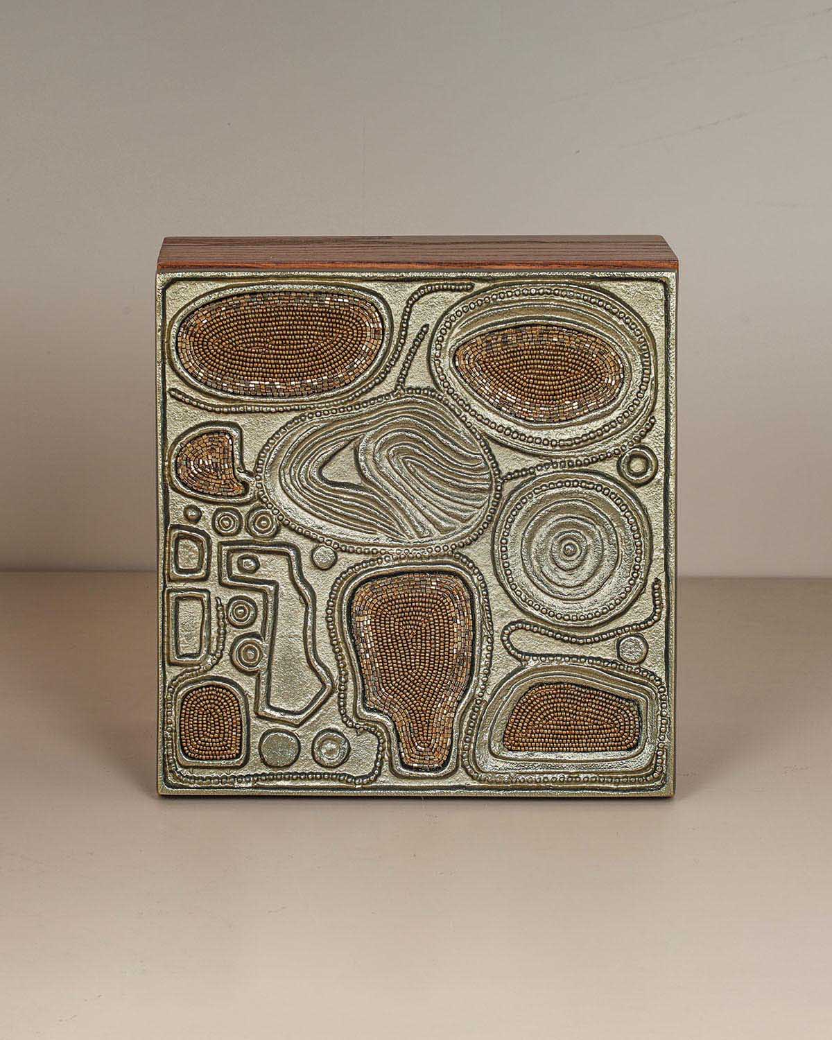 Luxury brass jewelry storage box with sculptural design and handcrafted texture.