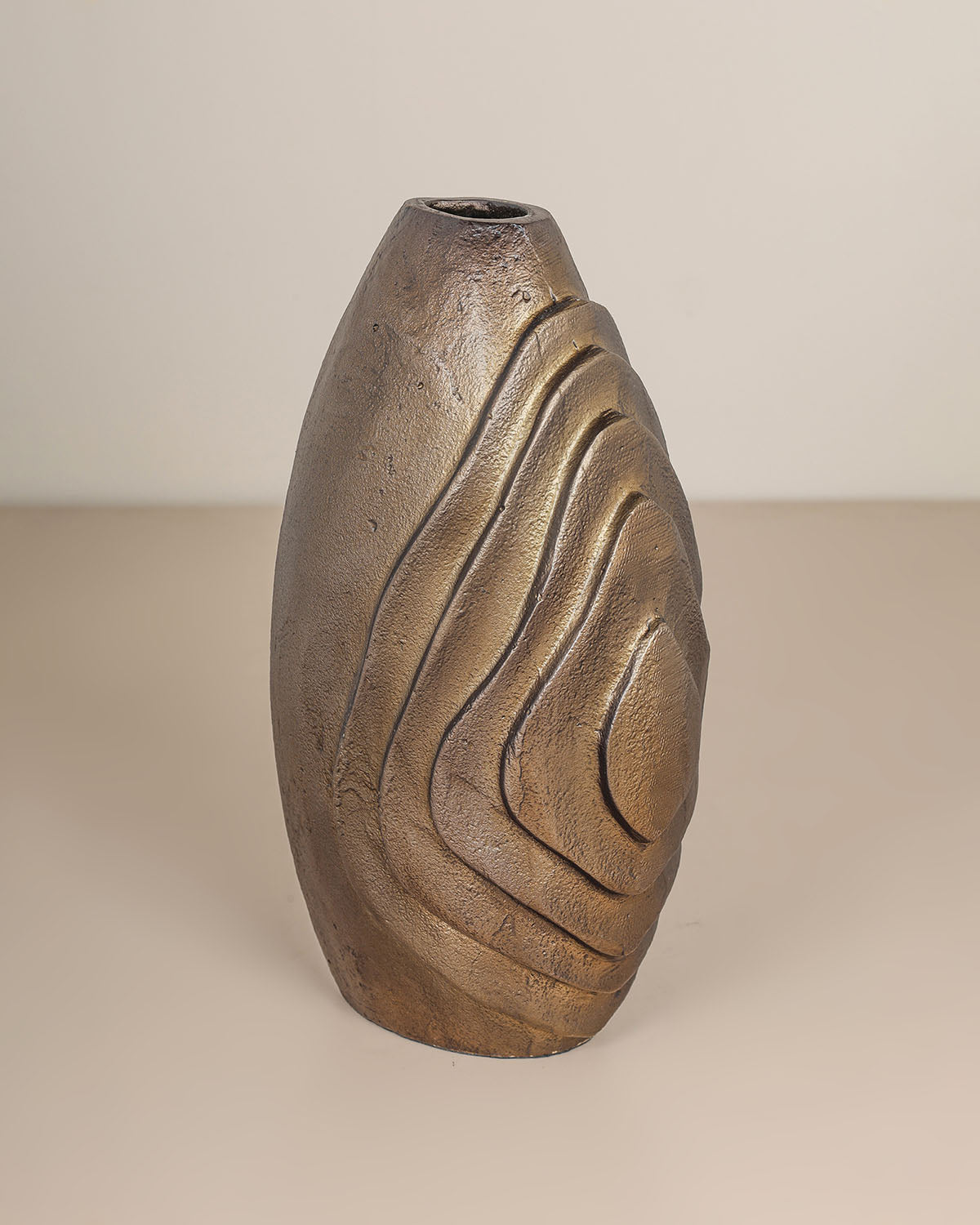 Luxury decorative metal vase with antique brass finish and sculptural design.