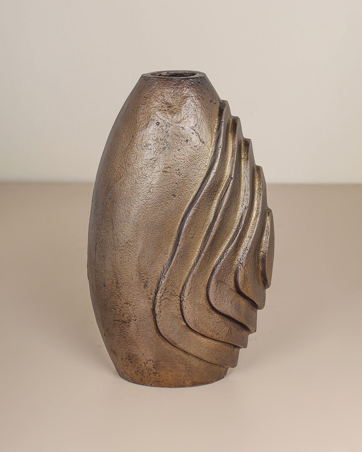 Luxury decorative metal vase with antique brass finish and sculptural design.