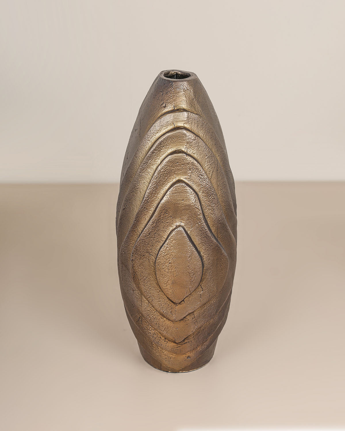 Luxury decorative metal vase with antique brass finish and sculptural design.